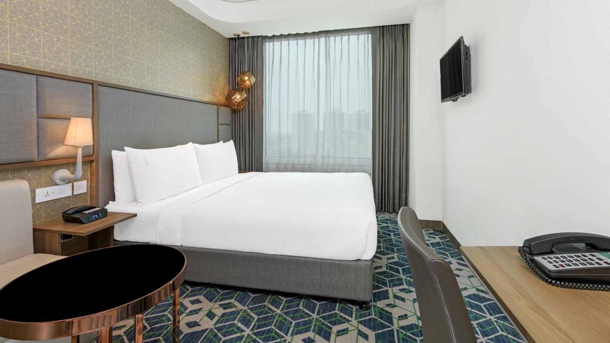 古尔冈90区假日酒店 外观 照片 A room at the hotel